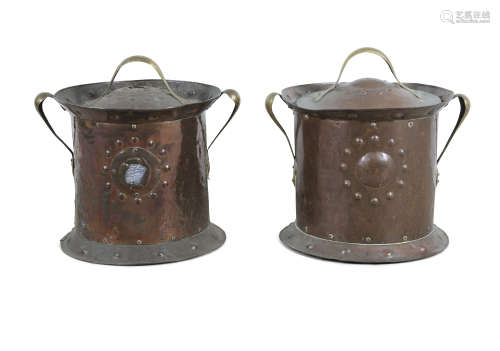 A MATCHED PAIR OF CYLINDRICAL COPPER COAL BUCKETS, the circular domed lids with brass handle and