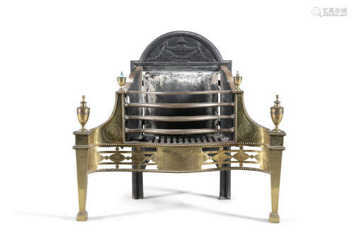 A GEORGE III SERPENTINE BRASS FIRE GRATE, c.1790, of classical form, with arched cast iron back