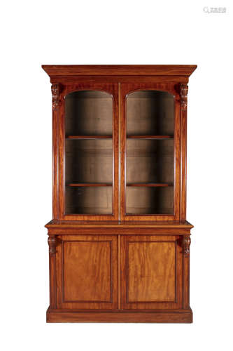 A VICTORIAN MAHOGNAY TWO DOOR BOOKCASE, the top section with moulded cornice above twin glazed