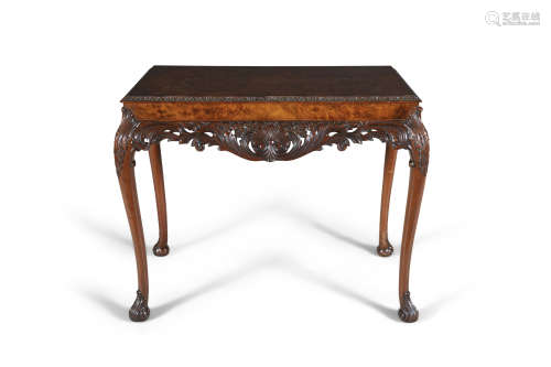 A WALNUT QUARTER VENEERED SIDE TABLE, early 20th century, of rectangular shape, with shell carved