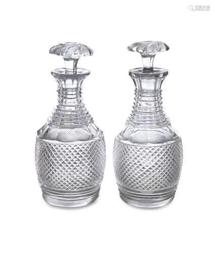 A PAIR OF 19TH CENTURY MALLET SHAPED DECANTERS with hobnail cut decoration, each 23cm high