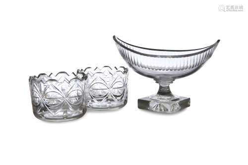 A PAIR OF CUT GLASS RINSERS, each 11.5cm wide and a navette shaped fruit bowl on foot, 23cm wide