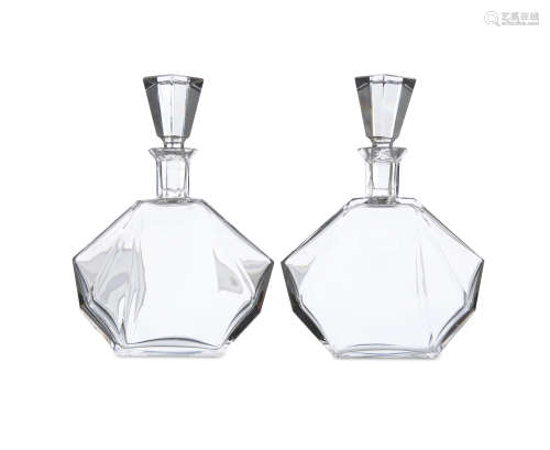 A PAIR OF ART DECO CLEAR GLASS DECANTERS AND STOPPERS, c.1930s; together with three moulded