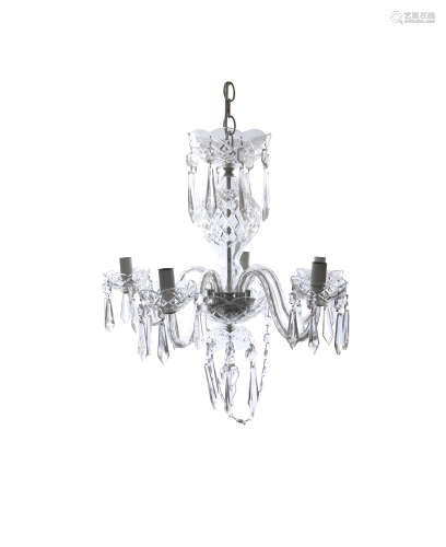 A WATERFORD CUT GLASS SIX BRANCH CEILING LIGHT, the corona and scroll arm branches hung with rose of