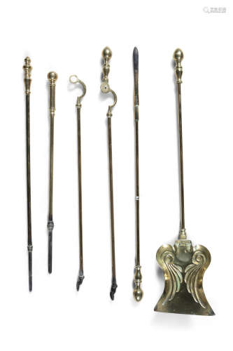 A SET OF THREE 19TH CENTURY FIRE BRASSES with turned handles comprising a poker, a shovel and a