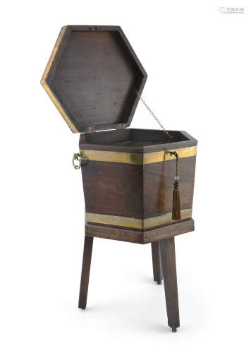 A GEORGE III MAHOGANY BRASS BANDED HEXAGONAL CELLARETTE ON STAND, the hinged top above tapered body,