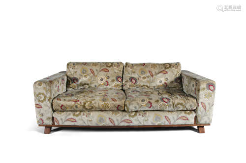 A TWO-SEATER FLORAL PATTERNED COUCH BY LINLEY, upholstered in biscuit beige fabric with floral