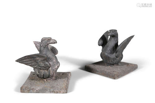A PAIR OF HEAVY CAST IRON MOUNTS, 19th century, formed as a pair of nesting eagles, on a square
