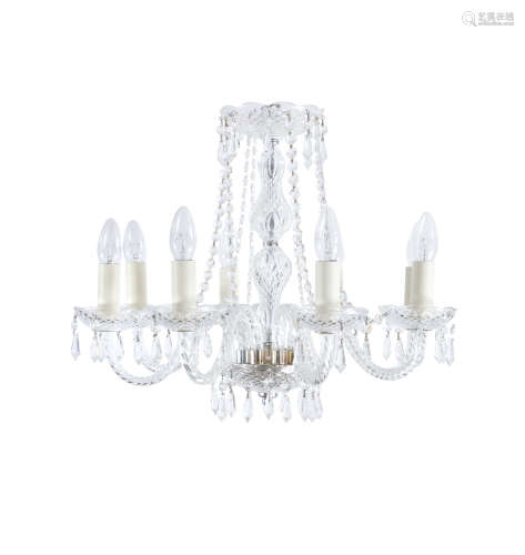 AN EIGHT BRANCH CLEAR GLASS CHANDELIER, mid 20th century, with domed corona and baluster centre