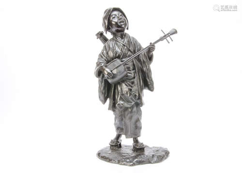 A Japanese Meiji period bronze figure, modelled as a female musician standing, singing with Japanese