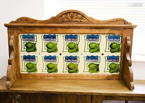 An Art Nouveau washstand tiled dressing table back, the stylised floral blue, mauve and green