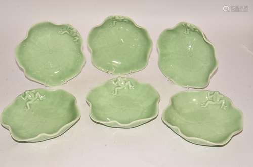 A set of six contemporary green glazed porcelain bowls, as lily leaves with moulded frog design,