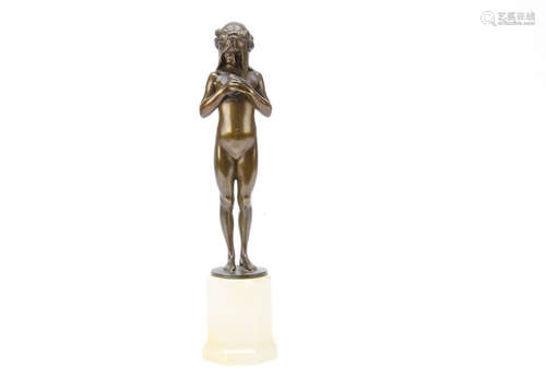 An Art Nouveau bronze figure by Eugene Wagner (1871-1942), depicting a young girl standing with a