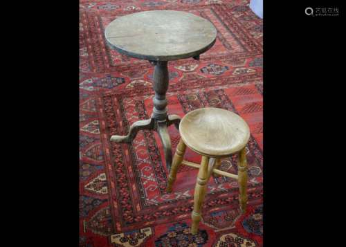 A 19th Century mahogany tilt top table, the turned pedestal on cabriole tripod supports, circular