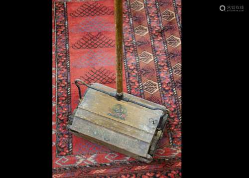 A Ewbank Royal Carpet sweeper, the oak veneered carpet sweeper with Ewbank Royal central crest