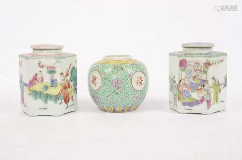 Two Chinese hexagonal famille rose tea caddies and covers, the hexagonal bodies decorated with