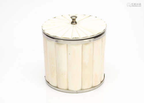 A contemporary bone and chrome ice bucket, of cylindrical form, the polished bone exterior capped