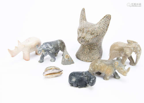 A collection of hardstone carved animals, including a carved head of a Burmese cat, soapstone