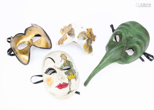 A contemporary plague mask, the papier mache plague mask in green with elongated nose, together with