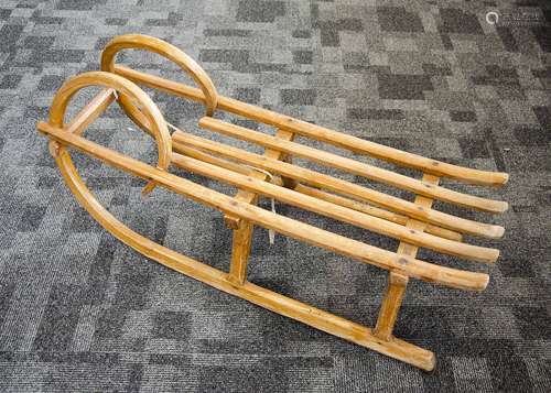 An oak Kurt Dorfel snow sledge, from ch.Schudlich bearing metal label to underside with steel feet