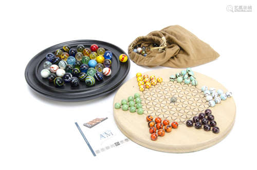 A contemporary oak star solitaire board, with coloured marbles, board 30cm, a contemporary German