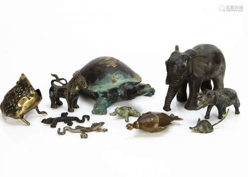 A collection of bronze and brass figures, including a Chinese brass bottle modelled as a fish with