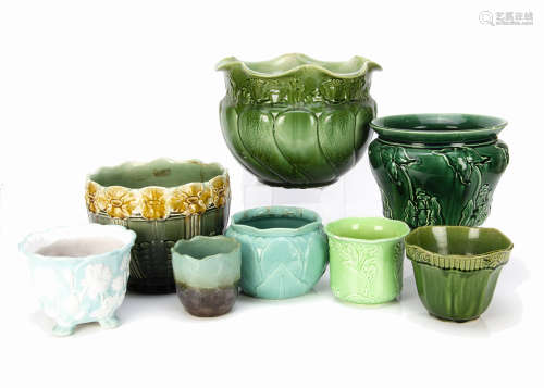 A collection of eight various British pottery and stoneware moulded jardinieres, in green and
