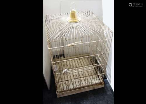 A large mid Century parrot cage, the wirework cage painted in white with simulated brass top, of