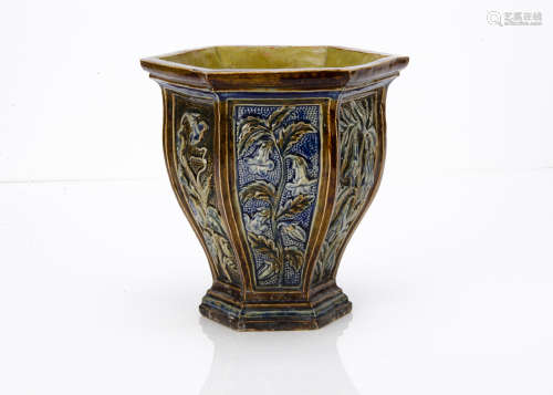 A British Arts and Crafts stoneware jardinière, of hexagonal tapered form, each panel decorated with