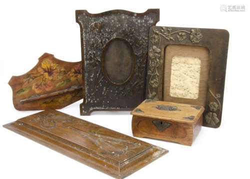 A collection of Art Nouveau carved wooden panels, pipe rack with painted floral design and oak