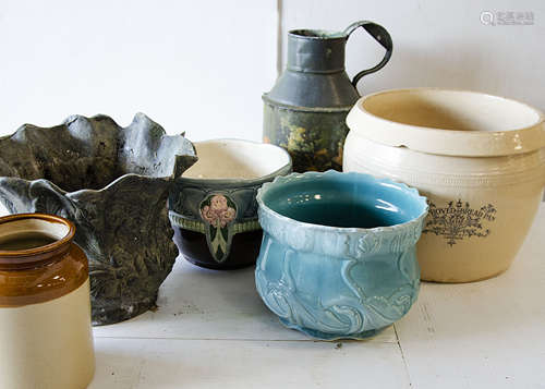 A collection of garden pots, including a spelter Art Nouveau style jardiniere, a twin handled Art