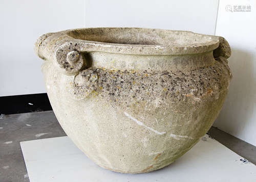 A large concrete planter, of circular tapered design with scroll twin handles, large open