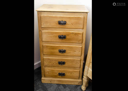 A stripped pine tallboy, the five uniform chest of drawers with anodised metal Art Nouveau handles