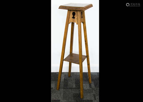 Three Art Nouveau occasional tables, all in oak, two with circular tops both on tripod pierced