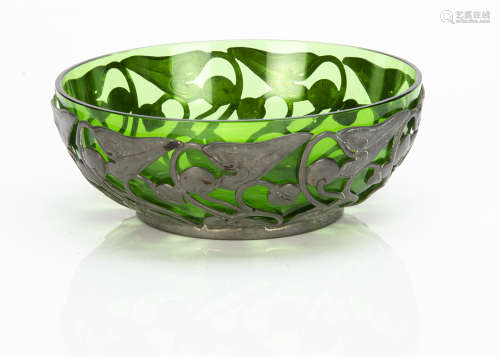 A continental Art Nouveau pewter bowl with green glass liner, the pewter bowl with all over stylised