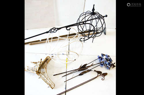 A collection of decorative ironwork, including simulated bluebells and daffodils, two spirals or