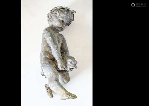 A lead fountain figure, of a putti riding a dolphin with its mouth open, water would spray from