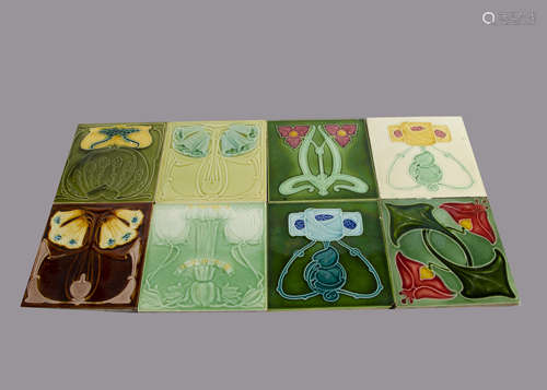 Eight Marsden Art Nouveau relief moulded tiles, floral design painted in colours, 15cm square Some