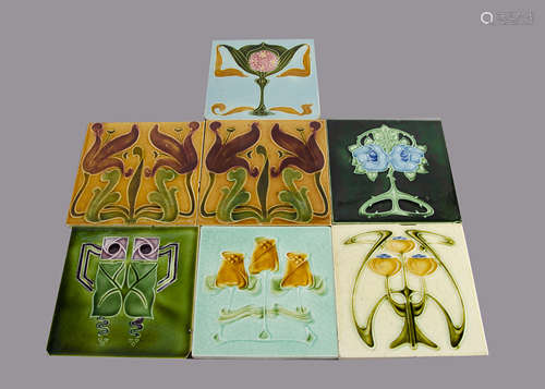 Seven T R Boote relief moulded Art Nouveau tiles, including a pair of stylised lily examples,