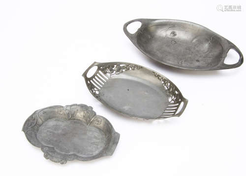 An Orivit pewter Jugendstil twin handle dish, with pierced berry design against a pierced grip and