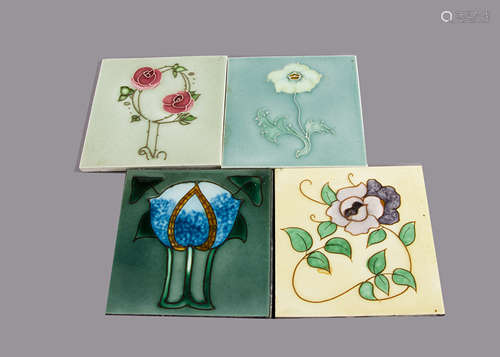 Four Henry Richards tube lined Art Nouveau tiles, all with stylised floral design, painted in