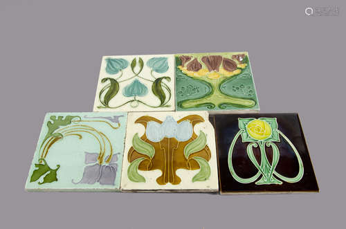 A collection of five British Art Nouveau tiles, relief moulded floral design, two by Malkin, another