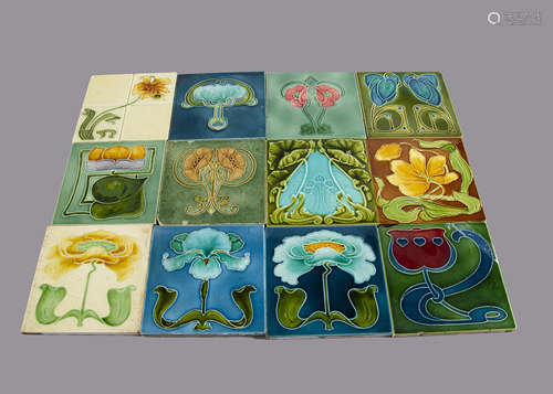 A collection of twelve J H Barratt & Co Art Nouveau tiles, all relief moulded floral decoration,