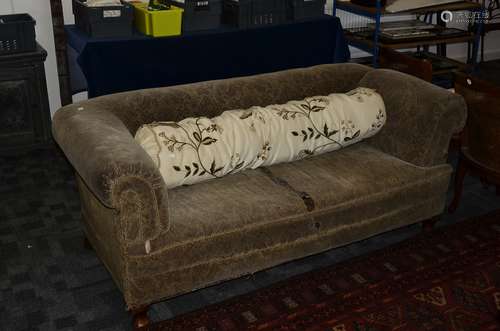 An Edwardian chesterfield sofa, with drop down end, the horse hair upholstered sofa with a patterned