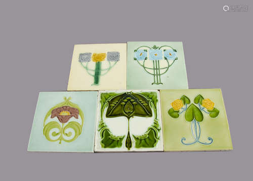 Five T A Simpson & Co Ltd tiles, each with floral decoration, various styles and colours, 15cm