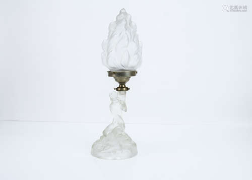 An Art Deco frosted glass table lamp, modelled as a kneeling nude female with draped robes