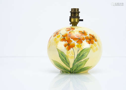 An Art Deco spherical pottery lamp base by Flosmaron, the transfer printed orange pansy against a