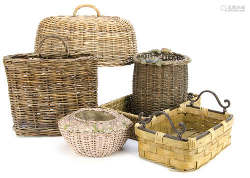 A collection of wicker baskets and food coverings, including an oval wicker food covering with