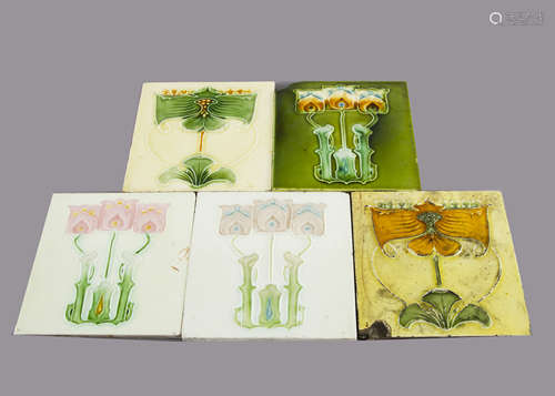 Five J & W Wade & Company Art Nouveau pottery tiles, relief moulded with stylised floral decoration,