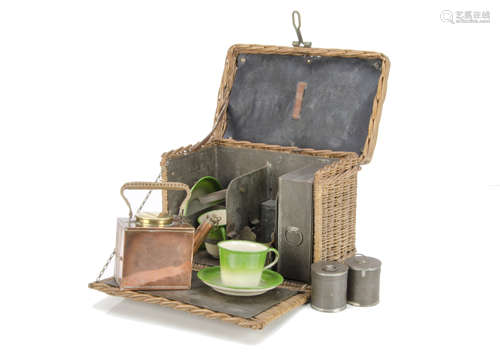 A late 19th/early 20th Century wicker picnic basket, with hinged top and fall down front with